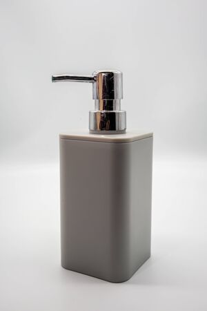 Hand pump sanitizer grey bottle isolated on white background.の写真素材