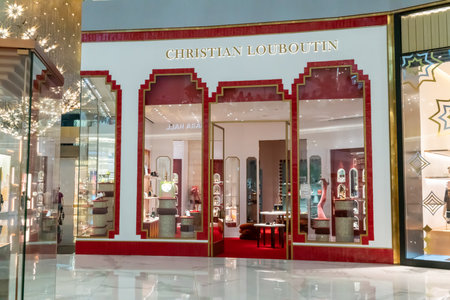 Christian Loboutine shop display at Icon Siam, Bangkok, Thailand, Nov 28, 2020 : Luxury fashionable clothing and shoes visual merchandising and window shopping in Christmas season greeting.のeditorial素材