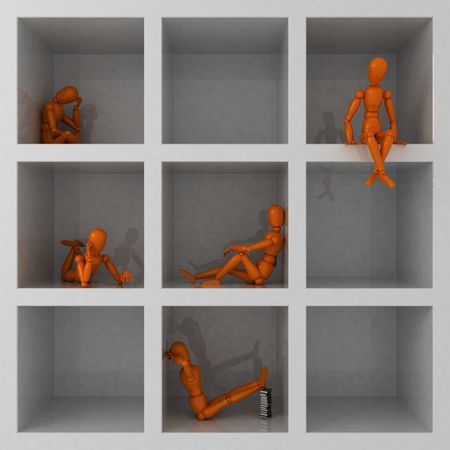 Five orange mannequins in cageの写真素材