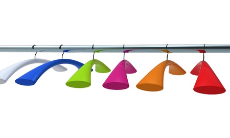 Varicoloured hangers on a metal bar.の写真素材