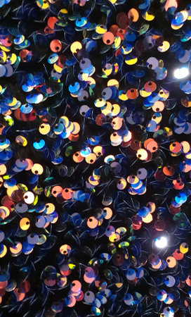 Colorful sequins in the shape of hearts as a background.の写真素材