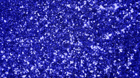 blue background with some fine grain in it and some spots on itの写真素材