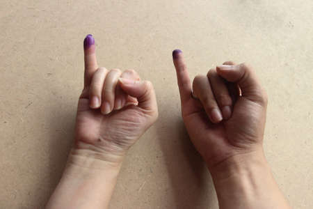 Magelang, Indonesia - December 9, 2020 : 
finger inked as evidence has done the vote for local election with health protocols during the Covid-19 pandemicのeditorial素材