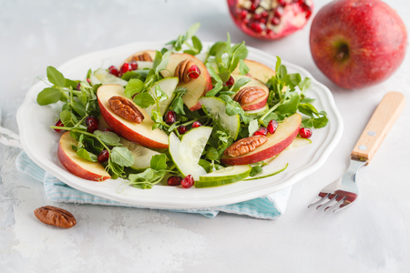 Light green apple pecan pomegranate salad. Vegan  Food Concept.の写真素材