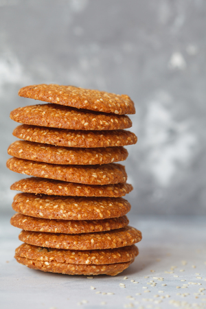 Round healthy biscuits made from white sesame and raisins. Vegan dessert concept.