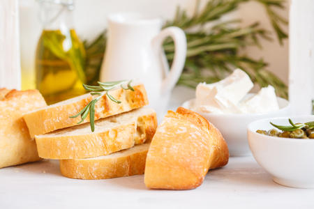 Fresh sandwiches with ciabatta and feta on a wooden boardの写真素材