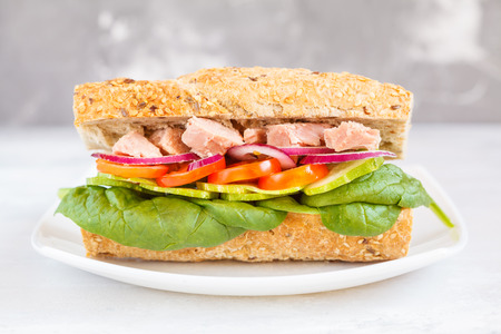 Healthy tuna sandwich with vegetables and rye baguette, macroの写真素材