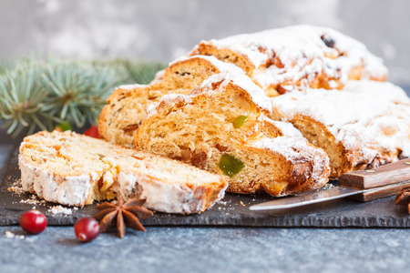 Christmas stollen, dark background. Traditional German festive baking.の写真素材