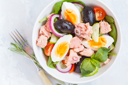 Tuna salad with egg, olives and spinach. Healthy salad concept.の写真素材