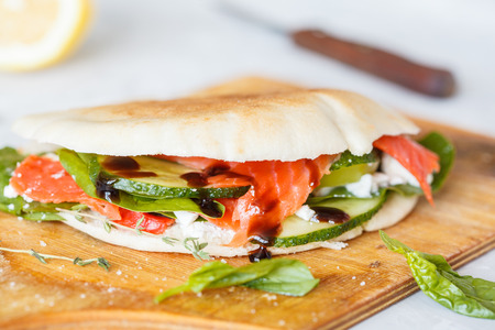 Salted salmon (sockeye salmon) with vegetables and feta in pita.の写真素材