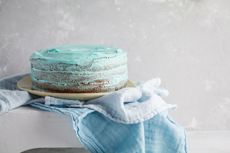 Blue stylish cake with flowers and mint. Copy spaceの写真素材