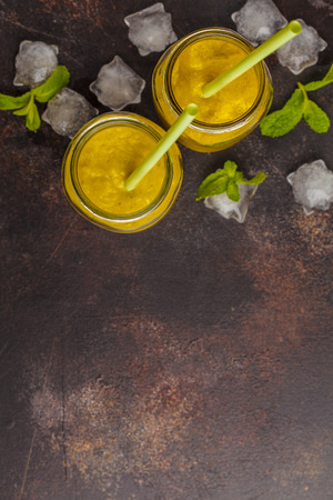 Green vegetable detox smoothies in a jar, top view. Healthy lifestyle concept.の写真素材