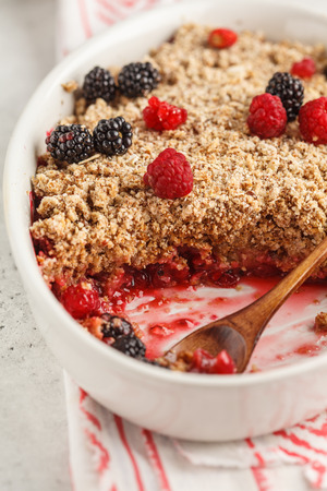 Breakfast with coffee and crumble pie, white background, healthy breakfast concept. Vegan berry dessert.の写真素材