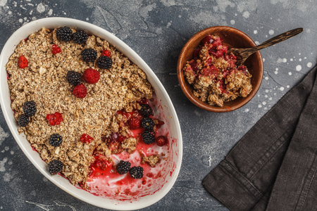Breakfast with coffee and crumble pie, dark background, healthy breakfast concept, top view. Vegan berry dessert.の写真素材