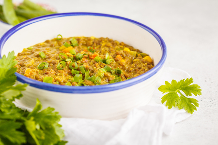 Lentil curry, Indian cuisine, tarka dal, white background. Vegan food. Clean eating concept.の写真素材
