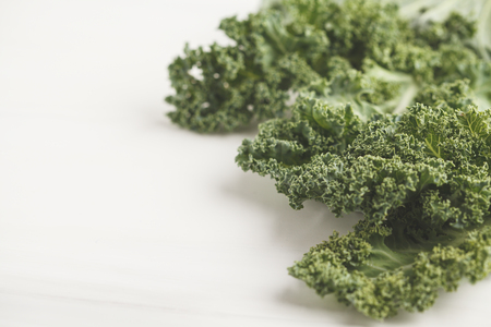 Fresh green leaves of kale on white background. Clean eating concept.の写真素材