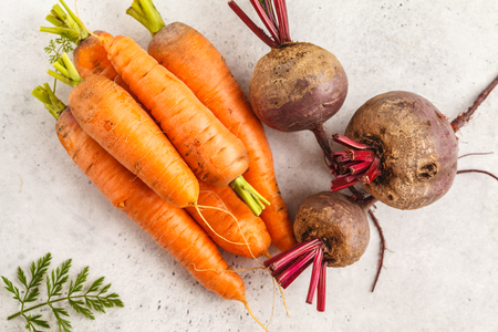 Raw carrots and beets on a white background. Clean eating concept.の写真素材