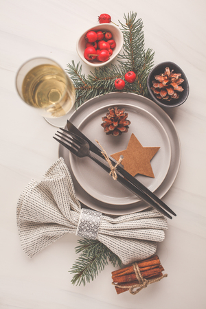 Christmas beautiful table setting. Christmas postcard. White background, christmas concept.の写真素材