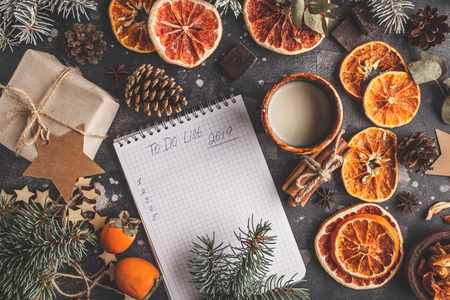 To do list for the new year on a dark background Christmas decorations. Christmas flat lay, top view, space for text.の写真素材