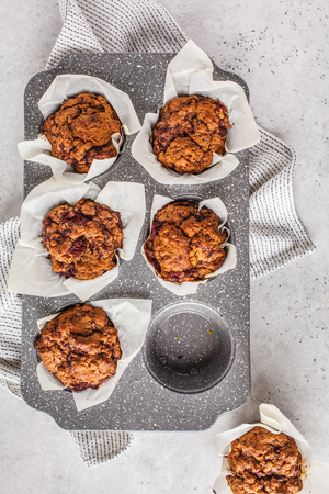 Healthy vegan berry muffins on a white background, top view. Plant based diet food concept.の写真素材