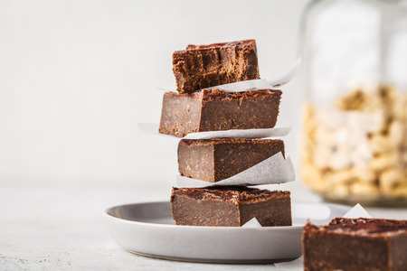 Raw Vegan Chocolate Cake Slices on white background. Plant based diet dessert.の写真素材