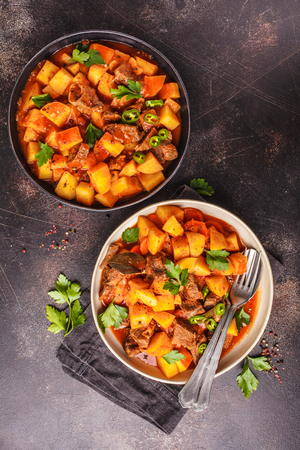 Beef stewed with potatoes in tomato sauce. Meat traditional goulash.の写真素材