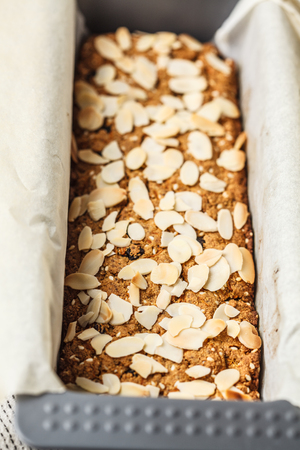 Vegan carrot cake with almonds on a white background. Plant based food concept.の写真素材