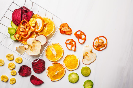 Dried vegetables and fruits on a white background. Plant based food concept.の写真素材