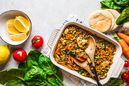 Vegan lentil curry with vegetables, top view. Healthy vegetarian food background.の写真素材