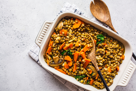 Vegan lentil curry with vegetables, top view. Healthy vegetarian food background, copy space.の写真素材