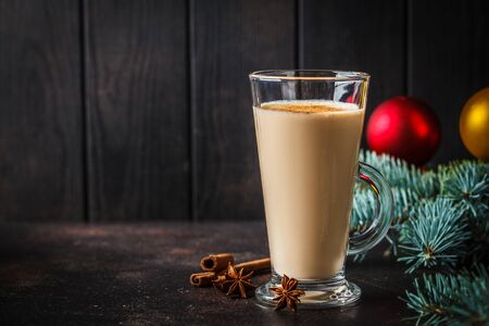 Christmas eggnog in a glass in a Christmas background.の写真素材