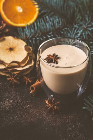 Christmas eggnog in a glass in a Christmas background.の写真素材