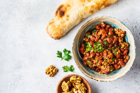 Georgian traditional beans lobio in a bowl on a white-gray background, copy space.の写真素材