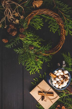 Christmas composition on dark background. Christmas wreath, gift and christmas decoration background.の写真素材