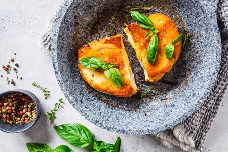 Fried sandwiches with cheese and wheat bread in a pan.の写真素材