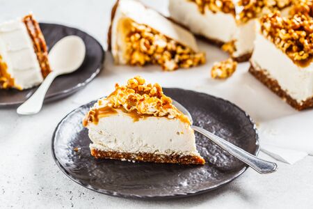 Raw vegan cashew cheesecake with coconut caramel popcorn. Raw vegan dessert concept.の写真素材