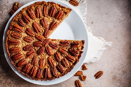 Pecan Pie on gray-brown background. Vegan dessert concept.の写真素材