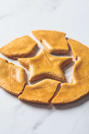 Dalgona Candy - South Korean treat. Round sugar cookie with a star inside.の写真素材