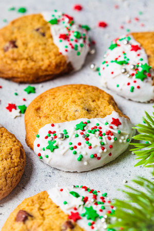 Christmas glazed cookies with festive sprinkles. holiday dessert concept.の写真素材