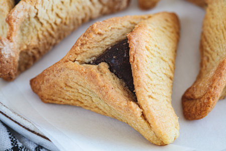 Hamantaschen cookies with chocolate for purim, close-up. Traditional Jewish dessert.の写真素材