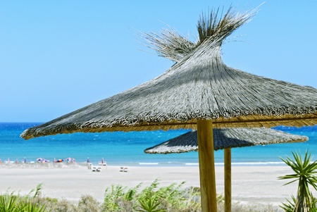 Beach umbrellas, blue sky and blue ocean.  Fuerteventura, Spainの写真素材