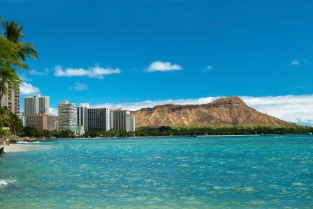 Waikiki beach with azure water in Hawaii with Diamond Head in background 