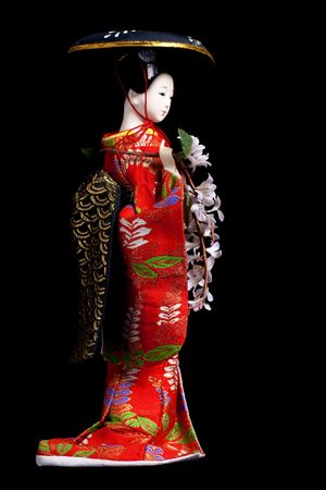 Asian geisha doll over black backgroundの写真素材