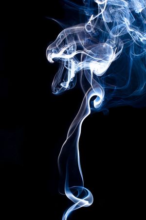 Abstract smoke over black backgroundの写真素材