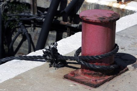 Sea port post with a rope, MORE SIMILAR AVAILABLEの写真素材