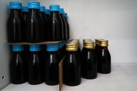 drug bottles on shelf in store or factory or hospital clinicの写真素材