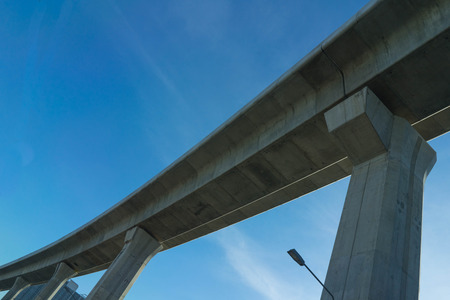express way curved bottom view architecture on blue sky background and cloudの写真素材