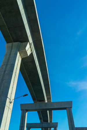 overpass curved bottom view architecture on blue sky background and cloud