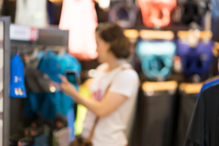 blur photo of woman shopping in store mallの写真素材