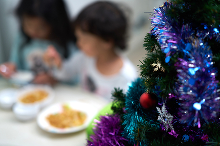 blur photo of kids eating and enjoy christmas party and new yearの写真素材